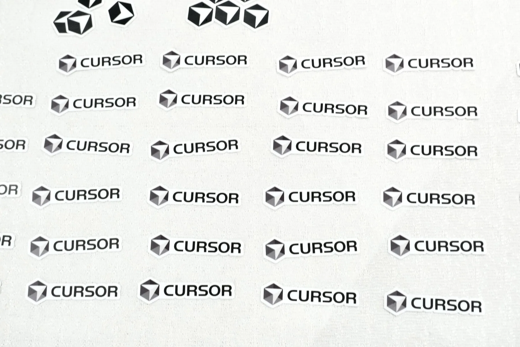Cursor stickers laid out at the Cursor Da Nang Meetup with Nick Miller